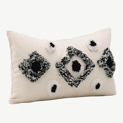 Must-valge tuftitud dekoratiivse padjakatte Melissa, 30×50 cm - 17047-500