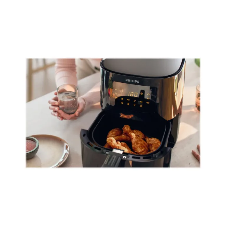 Philips Air Fryer HD9252/70 köögis roheviljade kõrval