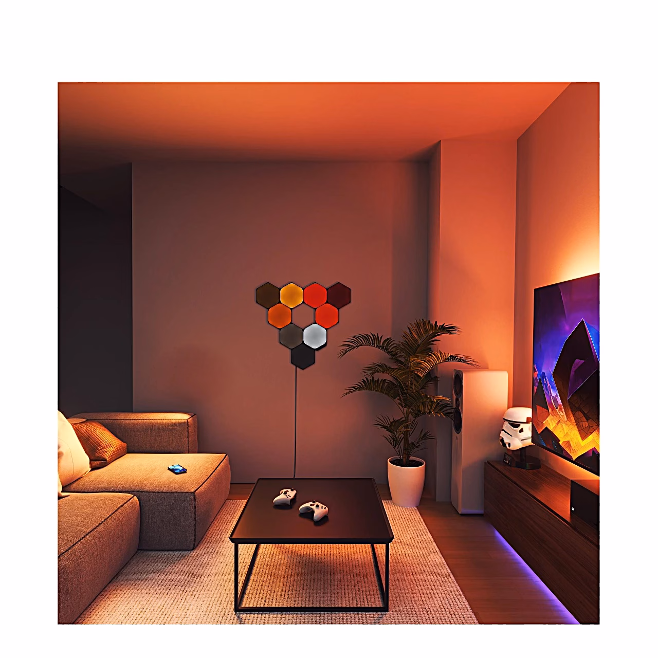 Nanoleaf Shapes kuusnurgad elutoa seinal punaste ja oranžide toonidega