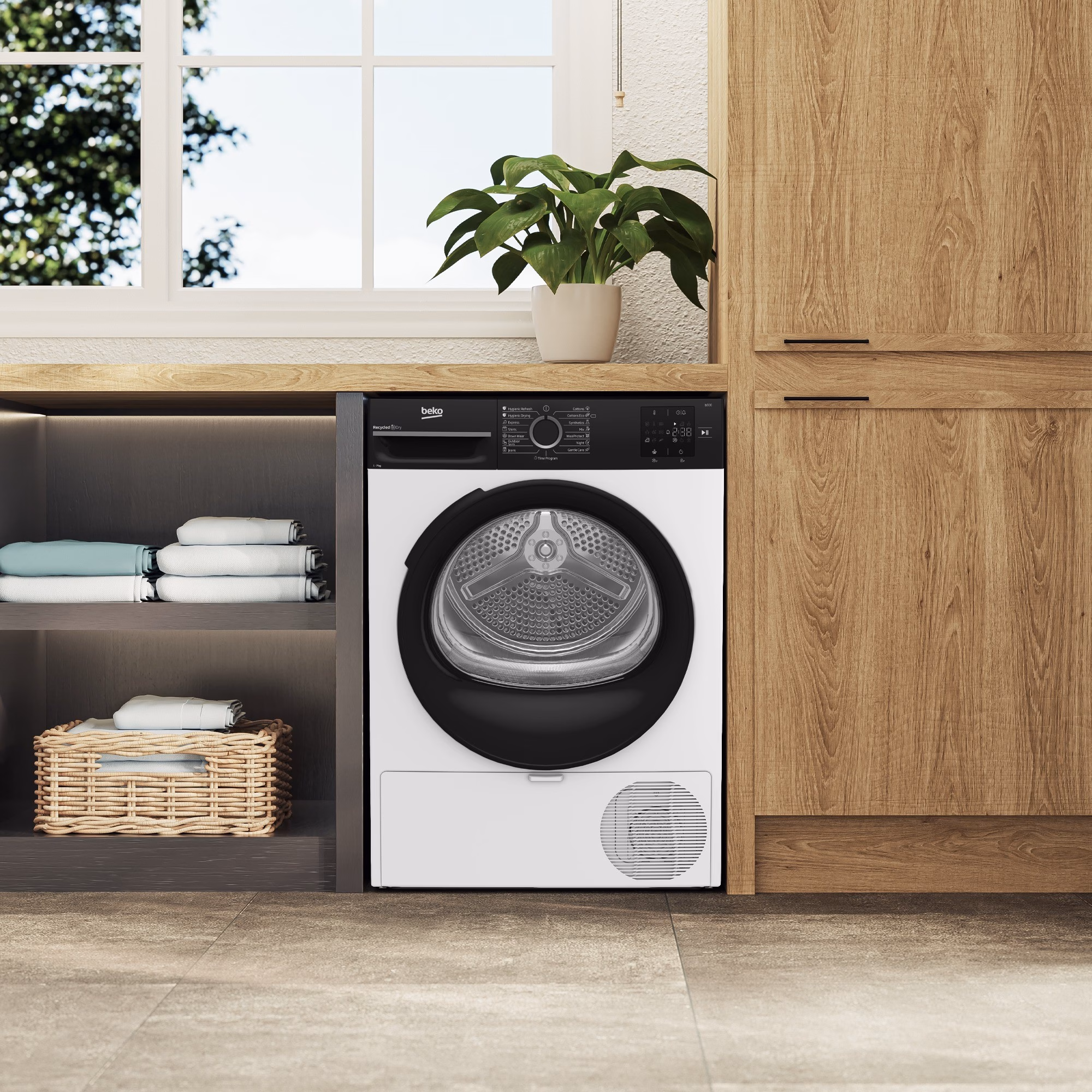 Trummelkuivati Beko BM3T37249WBB puidust kappide vahel pesuruumis