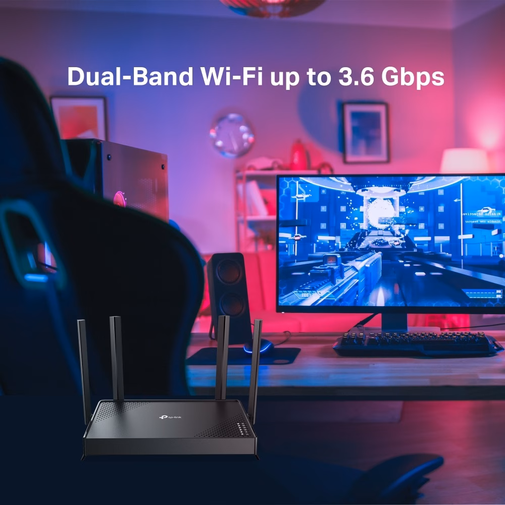 TP-Link Archer BE220 ruuter kirjutuslaual arvutimonitori ees